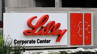 A sign for Eli Lilly & Co. sits outside their corporate headquarters.