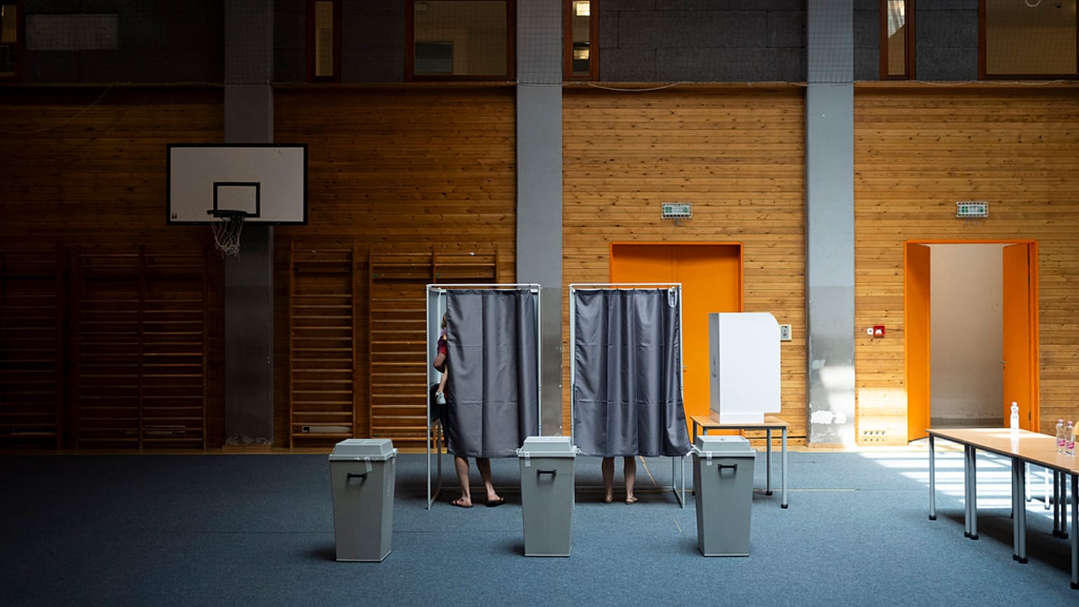 People vote at a polling station during the European Parliamentary elections, in Budapest, Hungary, Sunday, June 9, 2024. (AP Photo/Denes Erdos)