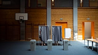 People vote at a polling station during the European Parliamentary elections, in Budapest, Hungary, Sunday, June 9, 2024. (AP Photo/Denes Erdos)