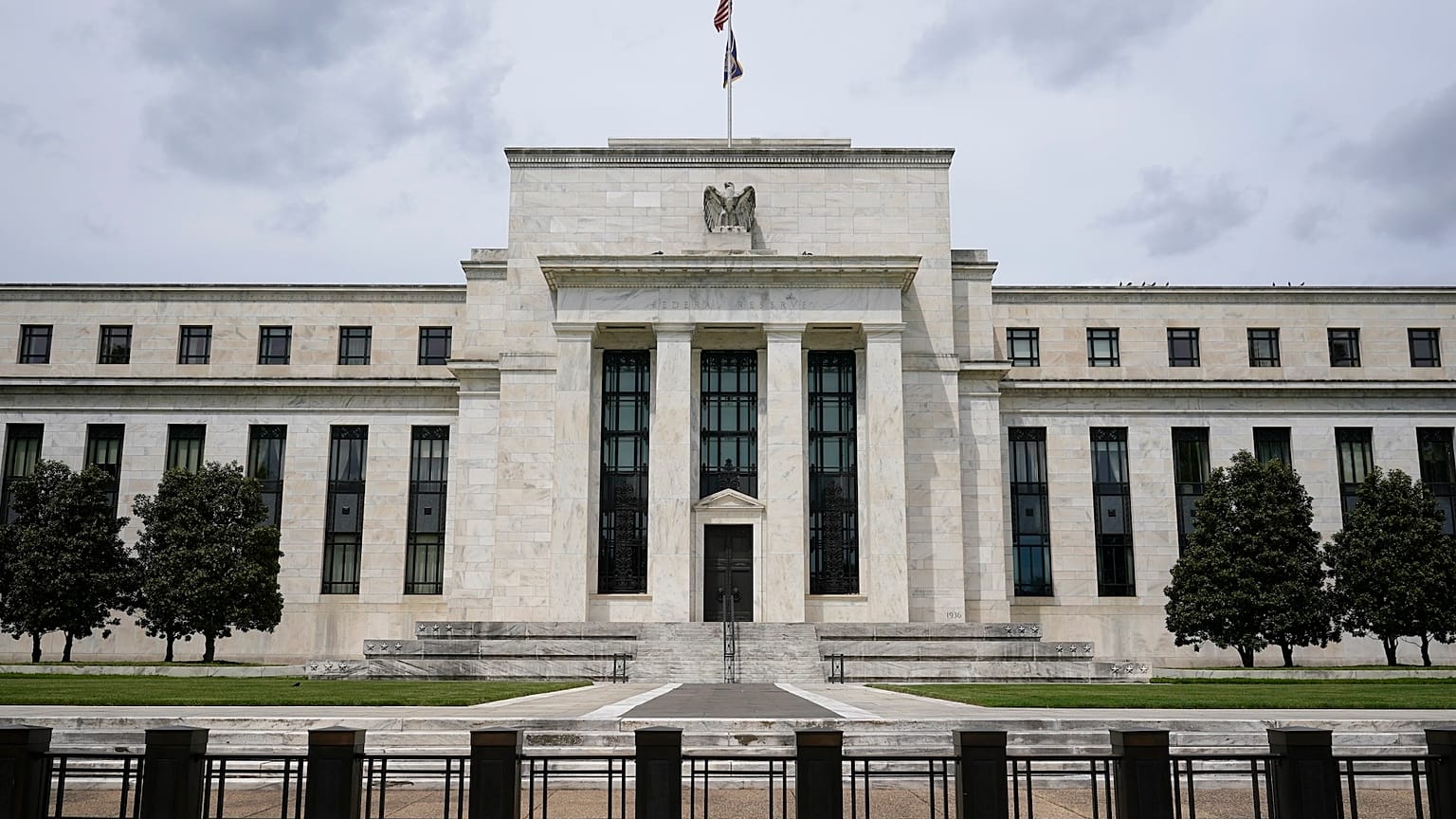 An American flag flies over the Federal Reserve building in Washington