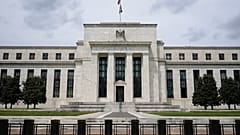 An American flag flies over the Federal Reserve building in Washington