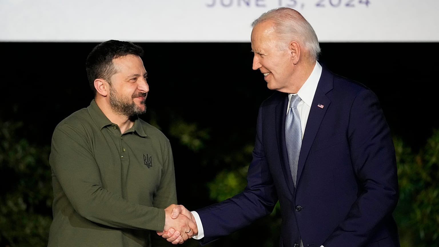 U.S. President Joe Biden, right, shakes hands with Ukraine's President Volodymyr Zelenskyy at the G7 summit at Savelletri, Italy, Thursday, June 13, 2024. 