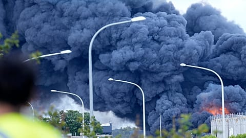 Fire rages on the roof of a commercial building at Brussels cargo airport in Brussels, Thursday, June 13, 2024.