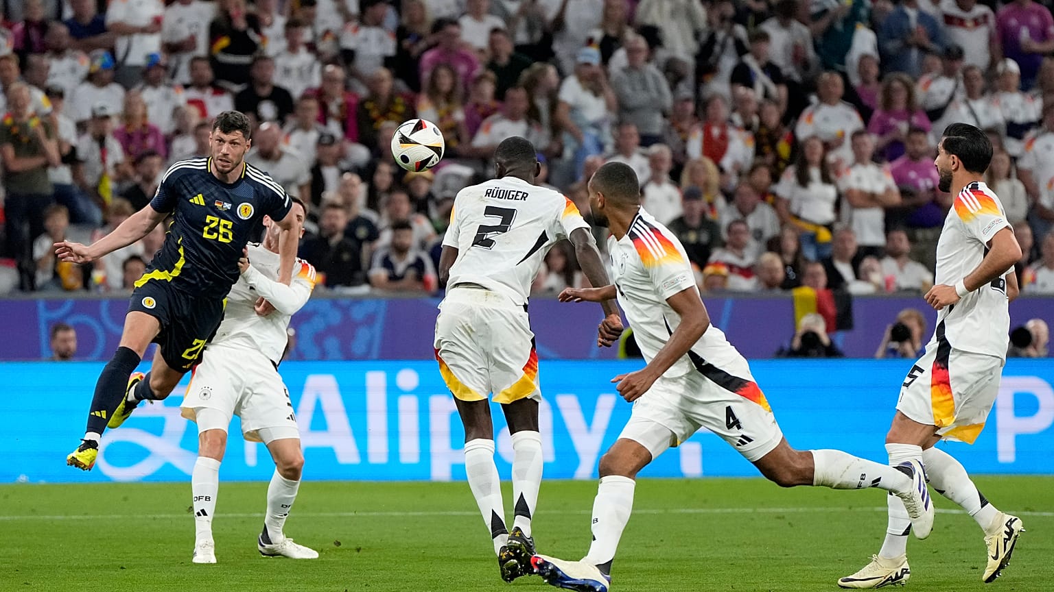 Germany's Antonio Rudiger scores an own goal for Scotland's first during a Group A match between Germany and Scotland at the Euro 2024 in Munich, June 14, 2024