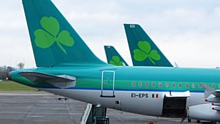 The shamrock logo of Ireland's Aer Lingus, adorns the tailfins of three Airbus A320 aircraft at Dublin Airport. Feb. 12, 2015.