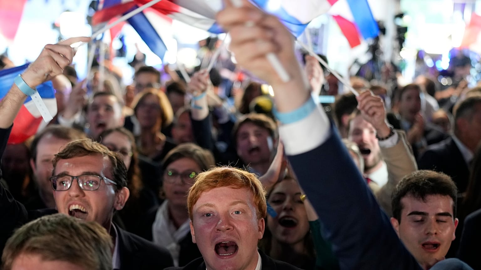 Supporters of French far-right National Rally react at the party election night headquarters, Sunday 9 June 2024
