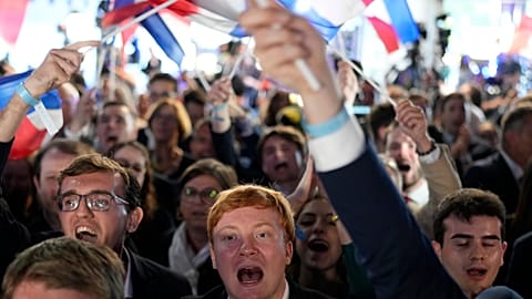 Supporters of French far-right National Rally react at the party election night headquarters, Sunday 9 June 2024