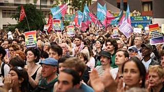 Supporters of the France's left-wing coalition known as the New Popular Front, gather to attend a meeting in Montreuil, east of Paris, Monday, June 17, 2024