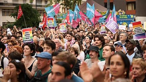 Supporters of the France's left-wing coalition known as the New Popular Front, gather to attend a meeting in Montreuil, east of Paris, Monday, June 17, 2024