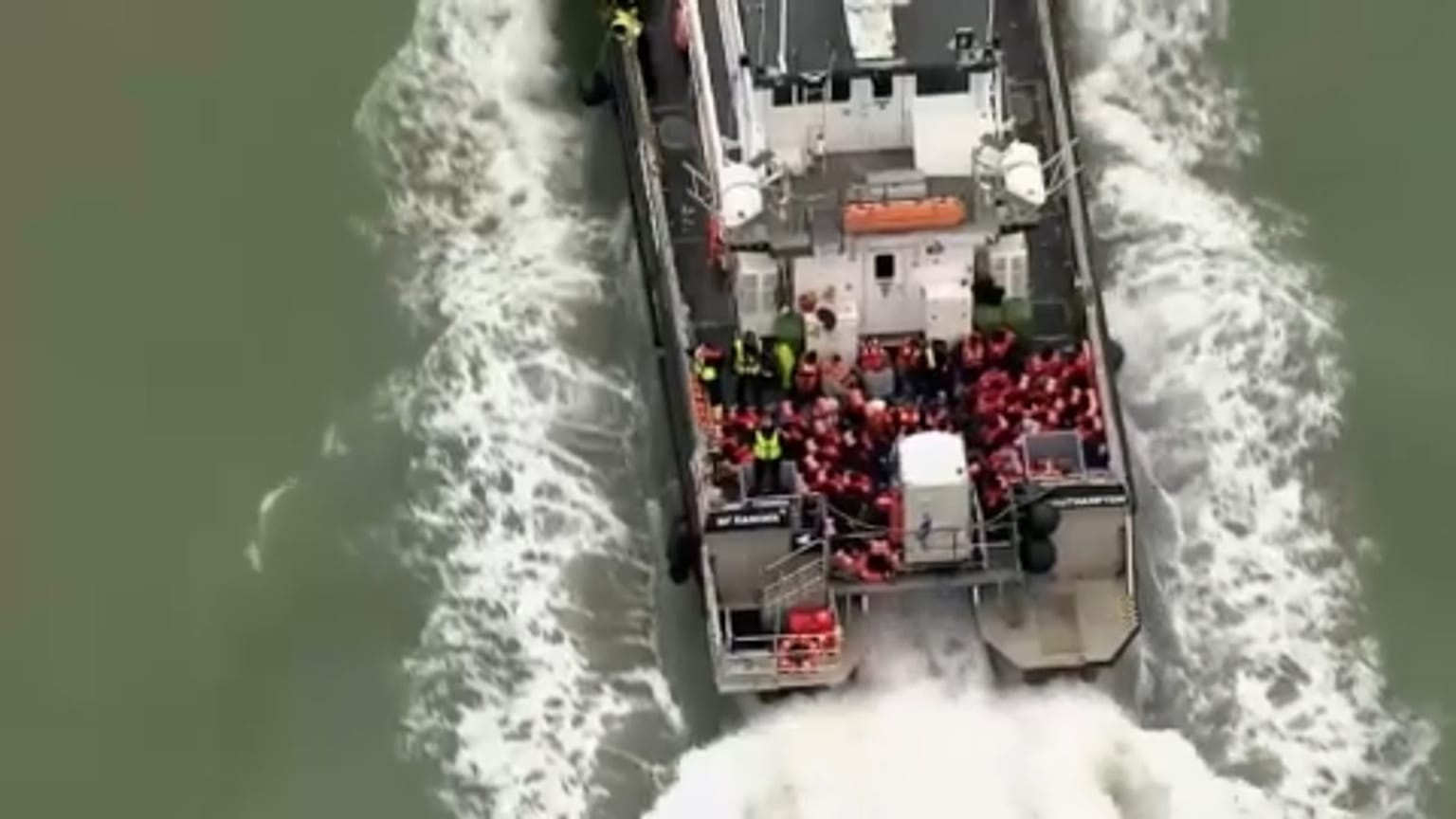 A Border Force boat carrying migrants including young children has docked in Dover.