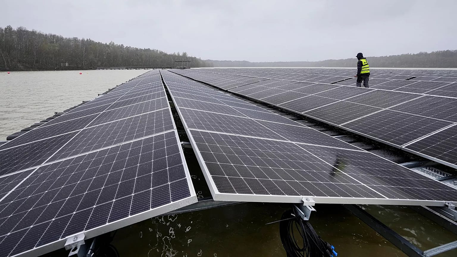 Solar panels are installed at a floating photovoltaic plant on a lake in Haltern. - Copyright AP Photo/Martin Meissner, File