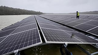 Solar panels are installed at a floating photovoltaic plant on a lake in Haltern. - Copyright AP Photo/Martin Meissner, File