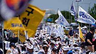 Members of The Korea Medical Association attend at a rally against the government's medical policy in Seoul, South Korea, Tuesday, June 18, 2024.