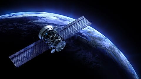An image of a satellite and planet.