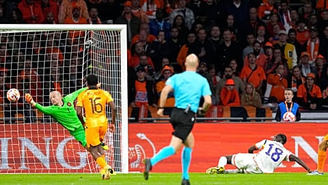 Netherlands' goalkeeper Remko Pasveer and Belgium's Amadou Onana during the UEFA Nations League soccer match between the Netherlands and Belgium, Sept. 25, 2022.