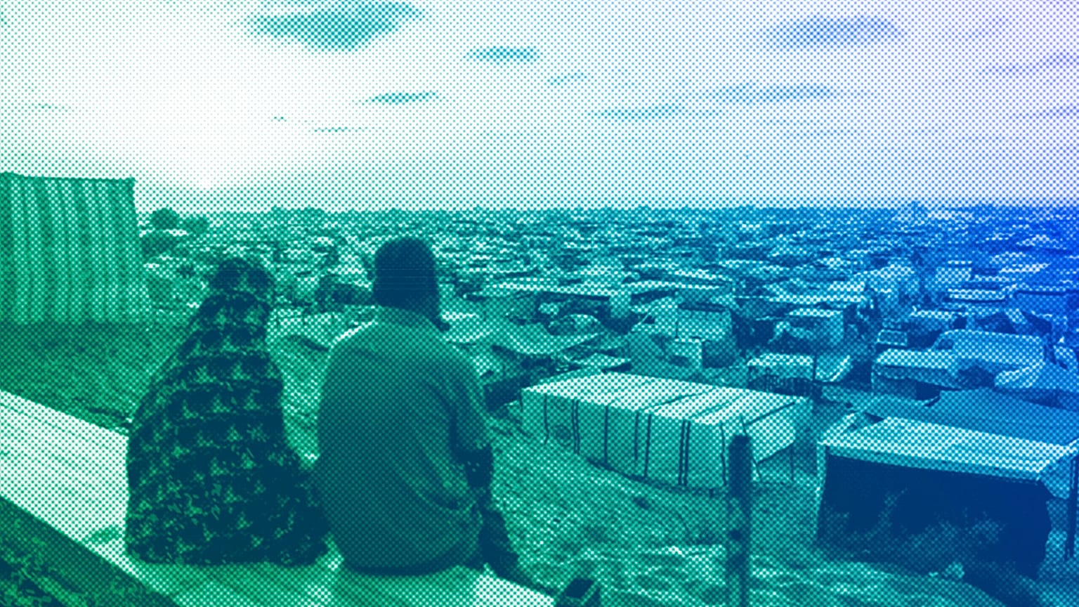 Palestinians displaced by the Israeli air and ground offensive on the Gaza Strip sit at a makeshift tent camp in Khan Younis, June 2024