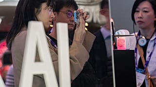 Visitors test products at the SK Telecom stand during the third day of the Mobile World Congress 2024 in Barcelona, Spain.