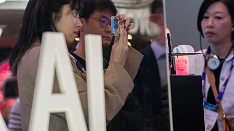 Visitors test products at the SK Telecom stand during the third day of the Mobile World Congress 2024 in Barcelona, Spain.