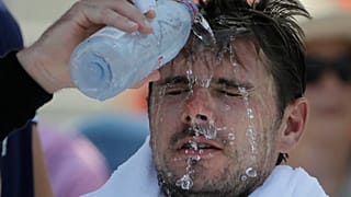 Stan Wawrinka, of Switzerland, pours water on his face during a changeover in his match against Ugo Humbert, of France, during the second round of the U.S. Open.