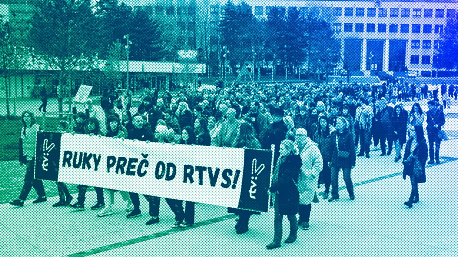 People hold a banner reading "Hands off (Slovakian public broadcaster) rtvs" as they take part in a protest in Bratislava, March 2024