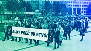 People hold a banner reading "Hands off (Slovakian public broadcaster) rtvs" as they take part in a protest in Bratislava, March 2024