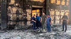 The head of Dagestan Republic Sergei Melikov, center, visits the damaged Kele-Numaz synagogue in Derbent after a counter-terrorist operation in republic of Dagestan, Russia. 