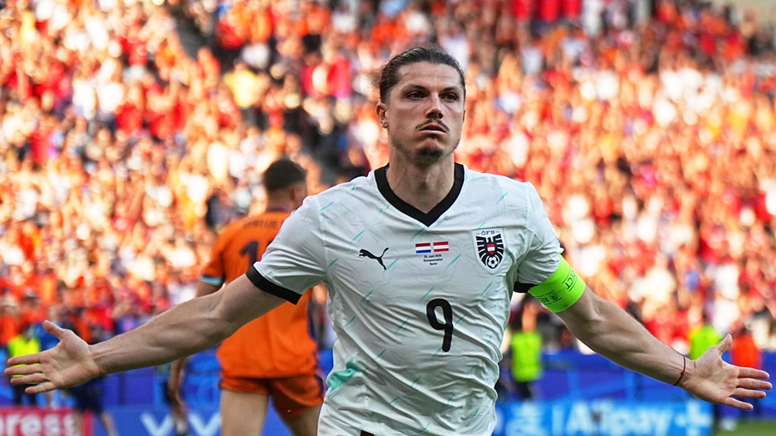 ustria's Marcel Sabitzer celebrates after scoring his side's third goal during a Group D match between the Netherlands and Austria 