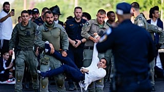 Israeli police disperse Ultra-Orthodox Jews blocking a highway during a protest against possible changes to regarding the laws for military drafts near Bnei Brak, 2 June 2024