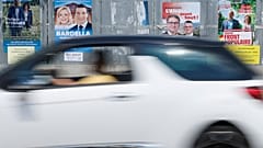 A car drives past electoral posters, Thursday, June 27, 2024 in Strasbourg, eastern France.
