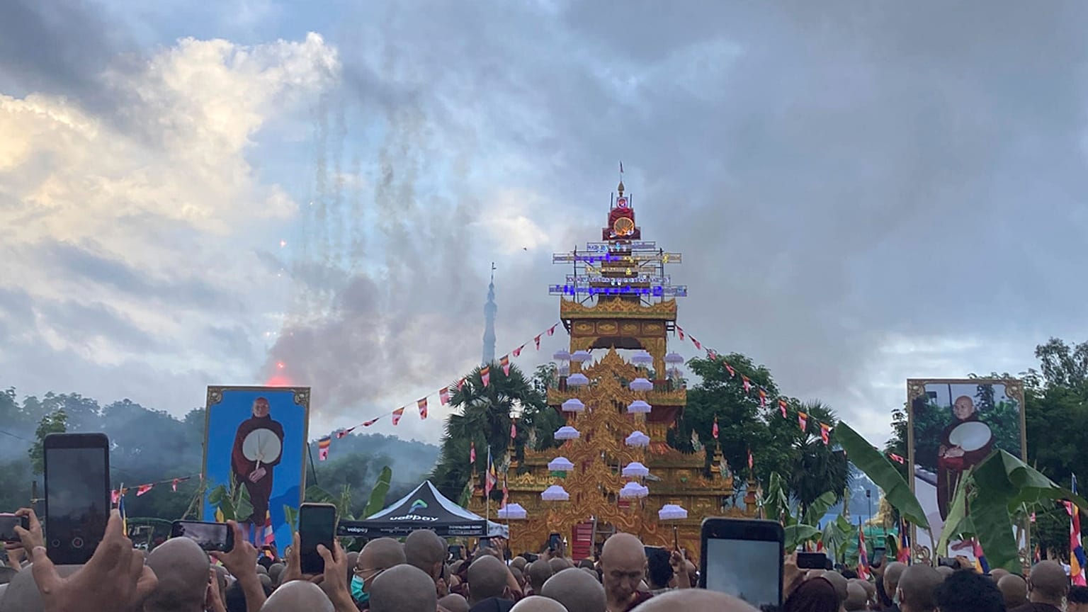 A crowd of Buddhist clergy and devotees attend the cremation of the late monk Bhaddanta Munindarbhivamsa in Bago, Myanmar