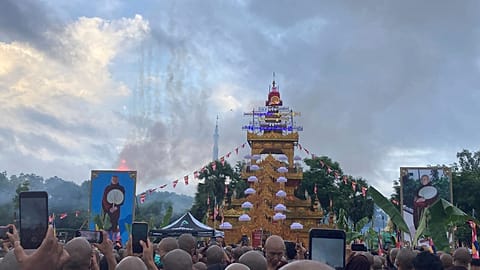 A crowd of Buddhist clergy and devotees attend the cremation of the late monk Bhaddanta Munindarbhivamsa in Bago, Myanmar