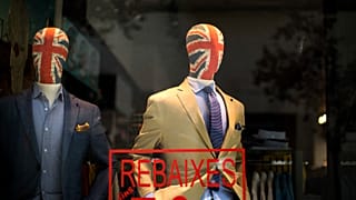 Mannequin with their heads decorated with Great Britain's union flag display fashion designers clothes in a tailoring shop in Barcelona, 25 June 2016