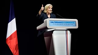 French far right leader Marine Le Pen thumbs up as she delivers her speech after the release of projections based on the actual vote count in select constituencies , Sunday