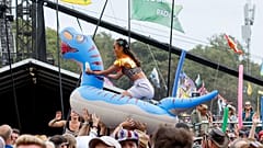 A festival goer rides an inflatable across the audience at the Shania Twain performance during the Glastonbury Festival in Worthy Farm, Somerset, England, June 30, 2024