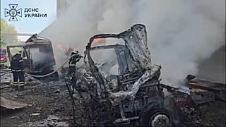 Firefighters put out a fire after an air attack from Russia.