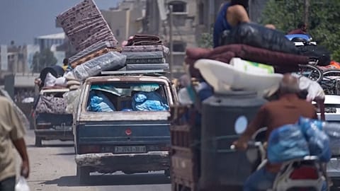 Various of vehicle carrying people's belongings as they evacuate