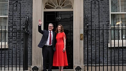 Britain's Labour Party Prime Minister Keir Starmer and his wife Victoria waves to the crowds of supporters and media from the doorstep of 10 Downing Street in London, Friday, 