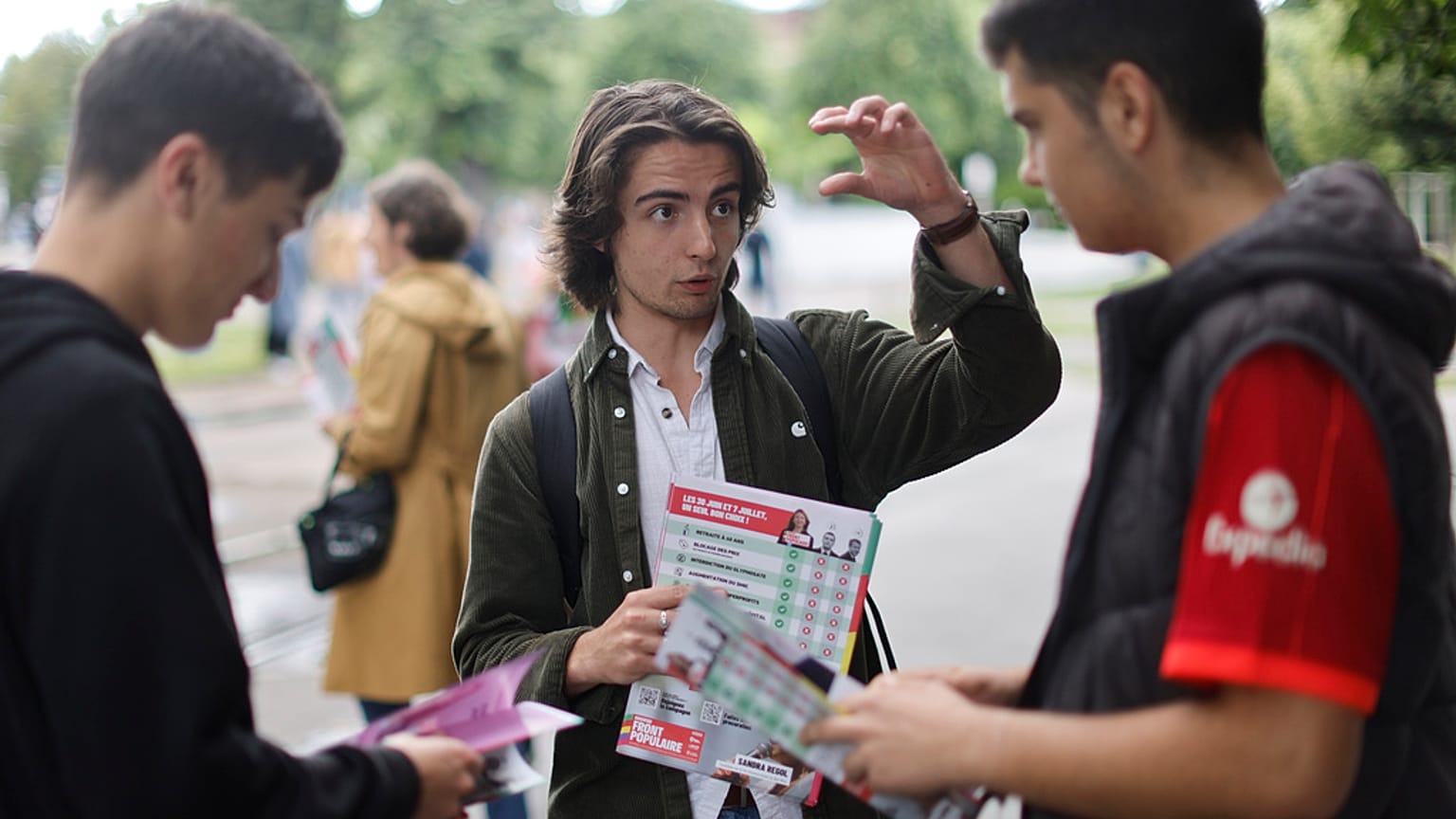  A supporter of the leftist coalition Nouveau Front Populaire (New Popular Front) campaigns for the second round of the legislative election, Thursday, July 4, 2024