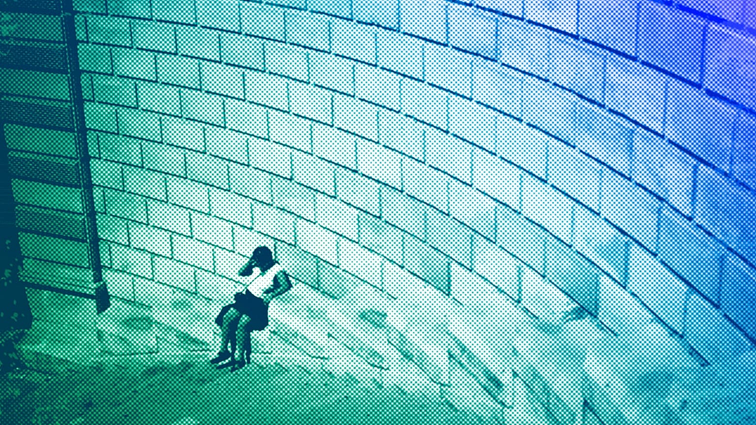 A woman sits down during high temperatures in Marseille, August 2023