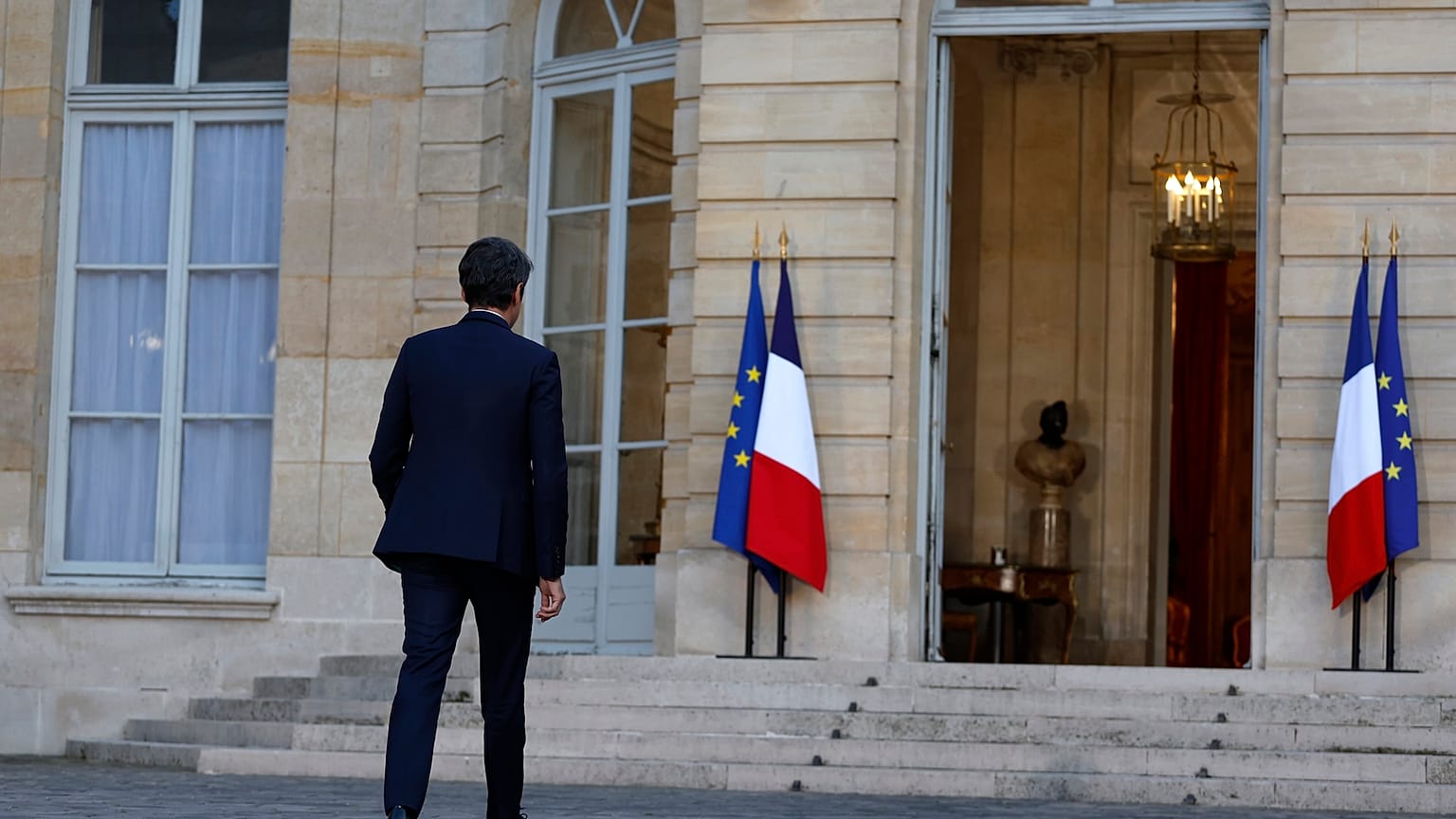 PM Gabriel Attal walks back into his residence on Sunday, 7 July after delivering his resignation speech. He is to stay on for the present.