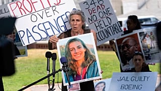 Nadia Milleron, the mother of Samya Rose Stumo, who died in the Ethiopia crash, holds a picture of her daughter at a protest in June