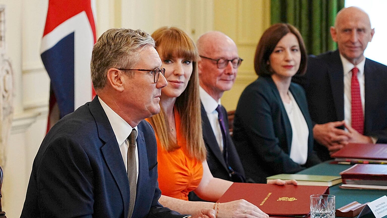 Britain's Prime Minister Keir Starmer, left, with Deputy Prime Minister Angela Rayner, second left, hosts his first Cabinet meeting at 10 Downing Street, London, July 2024. 