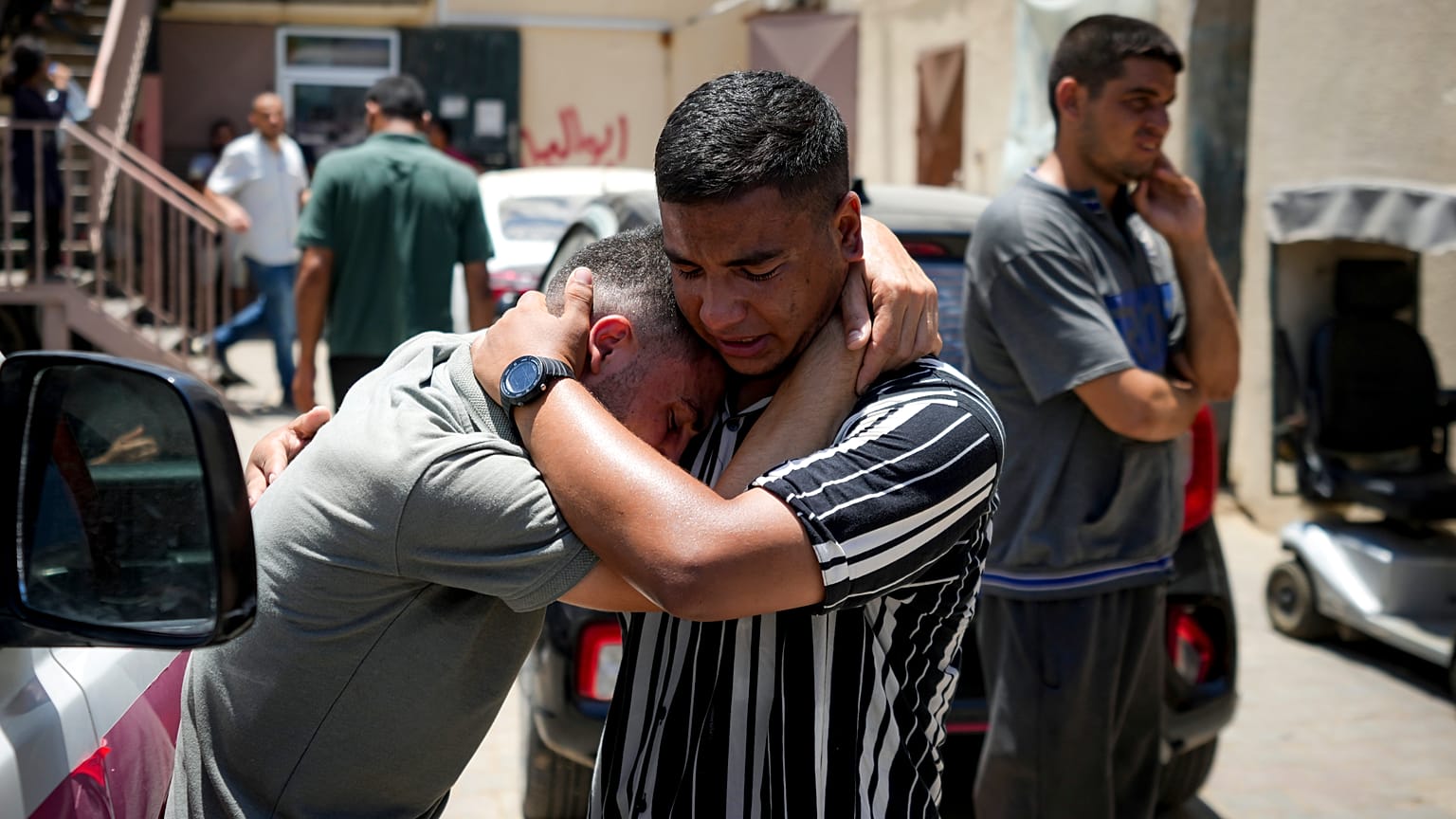 Palestinians mourn relatives killed in the Israeli bombardment of the Gaza Strip, at a hospital morgue in Deir al-Balah.