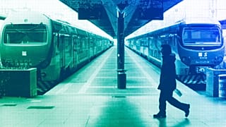 A man walks past trains in Milan, January 2012