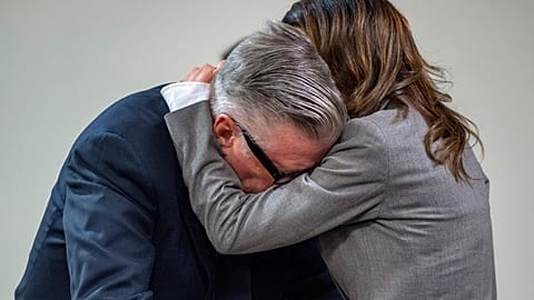 Actor Alec Baldwin, right, hugs his wife after the judge threw out the involuntary manslaughter case, July 12, 2024