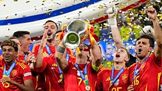 Spain's Mikel Oyarzabal, right, celebrates with Nico Williams and Lamine Yamal, left, after scoring his side's second goal during the final match between Spain and England