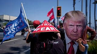 People rally in support of Republican presidential candidate former President Donald Trump in Huntington Beach, Calif., Sunday, July 14, 2024. (AP Photo/Eric Thayer)