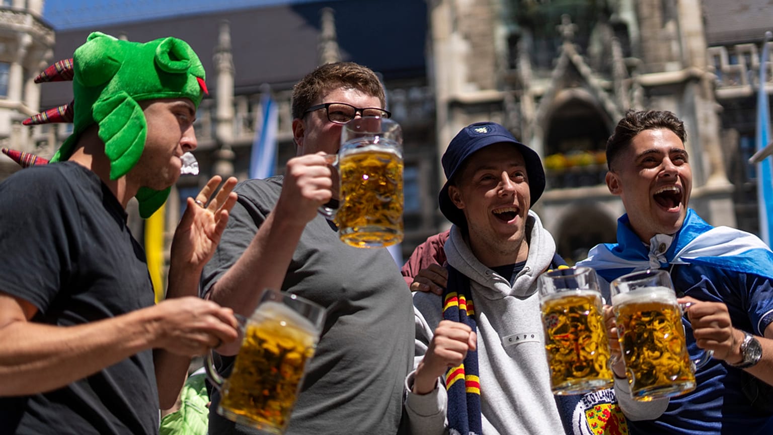 Scotland's football team fans drink beer in 'Marienplatz' square next to the town hall in downtown, Munich , Germany, Thursday, June 13, 2024. 