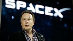 File - In this May 29, 2014 file photo, Elon Musk, CEO and CTO of SpaceX, introduces the SpaceX Dragon V2 spaceship at the SpaceX headquarters in Hawthorne, Calif. 