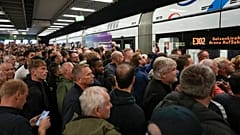 Football fans gather on train station ahead the Group C match between Serbia and England at the Euro 2024 soccer tournament in Gelsenkirchen, Germany